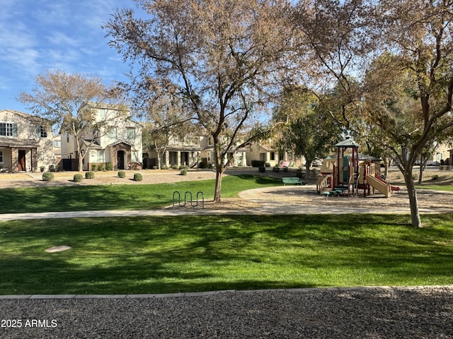 surrounding community featuring a yard and a playground