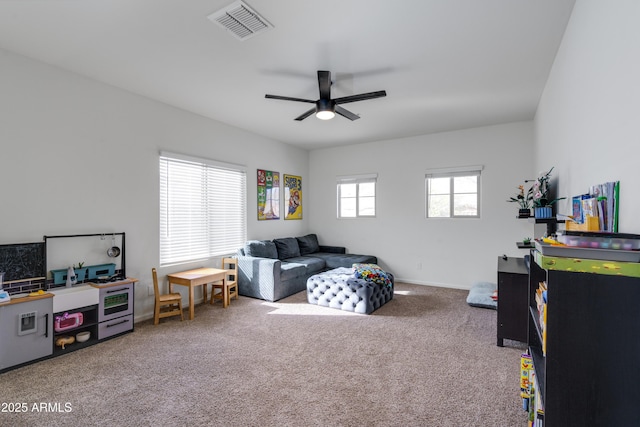 rec room with ceiling fan and carpet flooring