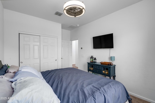 bedroom with a closet and carpet