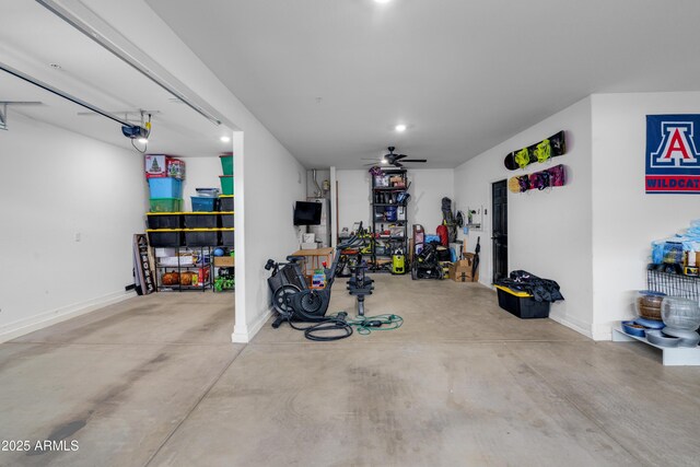 garage featuring a garage door opener and ceiling fan