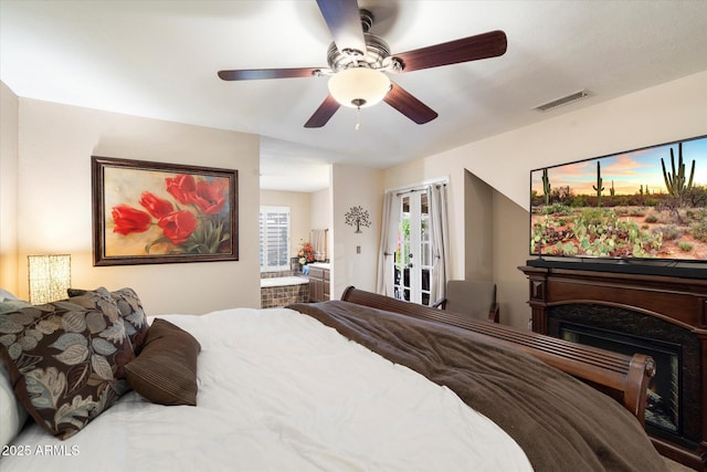 bedroom with ceiling fan and french doors