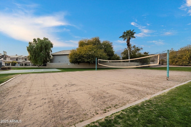 view of home's community featuring a lawn and volleyball court