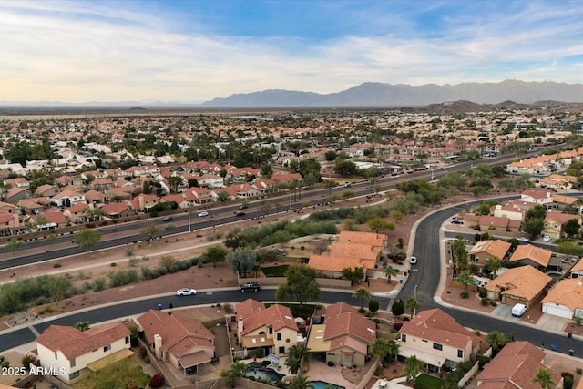 birds eye view of property featuring a mountain view