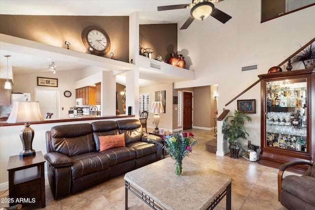 living room with high vaulted ceiling, ceiling fan, and light tile patterned flooring