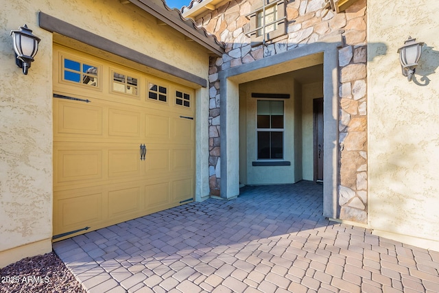 entrance to property featuring a garage