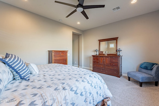 bedroom featuring ceiling fan and light carpet