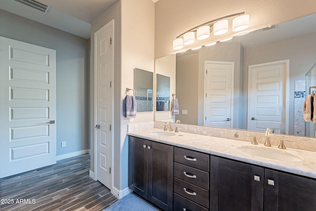 bathroom featuring vanity and hardwood / wood-style floors