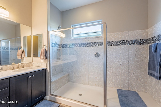 bathroom with vanity and an enclosed shower