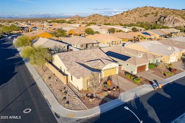 birds eye view of property with a mountain view