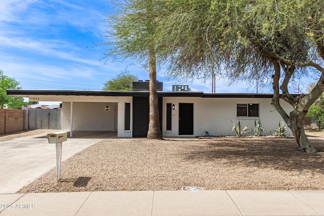 11842 N 30th Dr, Phoenix, AZ 85029 - ranch-style house featuring a carport, fence, driveway, and stucco siding