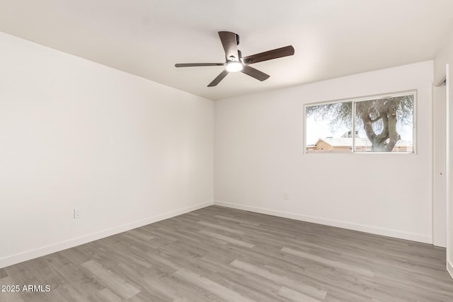 11842 N 30th Dr, Phoenix, AZ 85029 - empty room with wood finished floors, ceiling fan, and baseboards