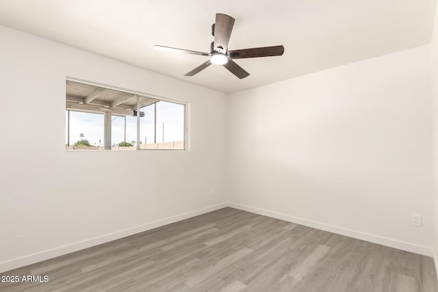 11842 N 30th Dr, Phoenix, AZ 85029 - spare room featuring baseboards, ceiling fan, and wood finished floors