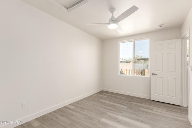 11842 N 30th Dr, Phoenix, AZ 85029 - unfurnished room with light wood-style flooring, attic access, ceiling fan, and baseboards