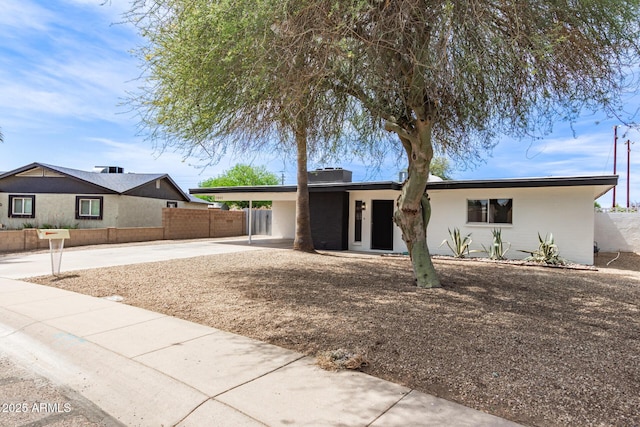 11842 N 30th Dr, Phoenix, AZ 85029 - ranch-style house featuring driveway, fence, an attached carport, and stucco siding