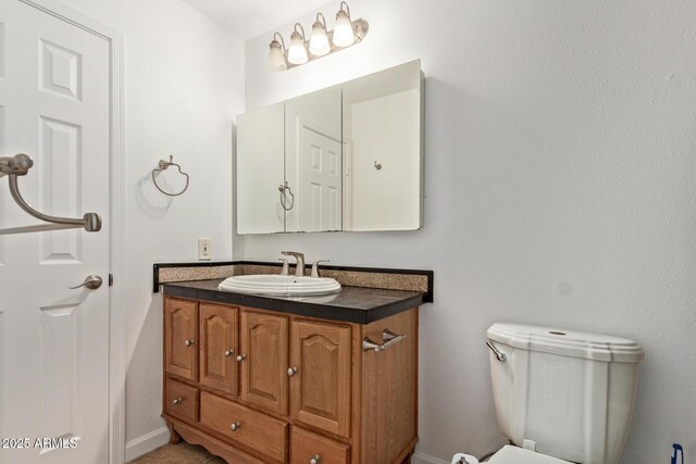 4629 S Mill Ave, Tempe, AZ 85282 - bathroom with vanity and baseboards