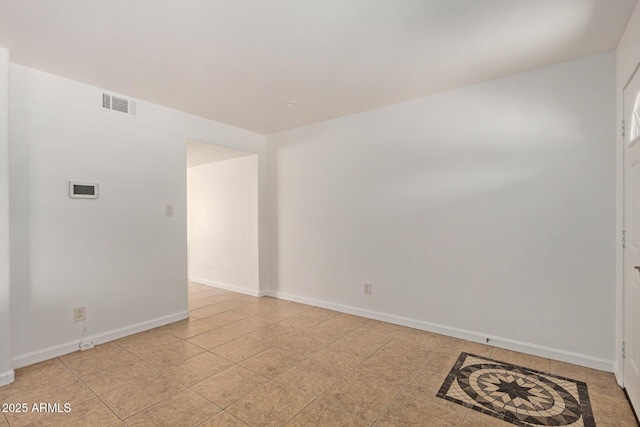 4629 S Mill Ave, Tempe, AZ 85282 - empty room with baseboards and light tile patterned floors