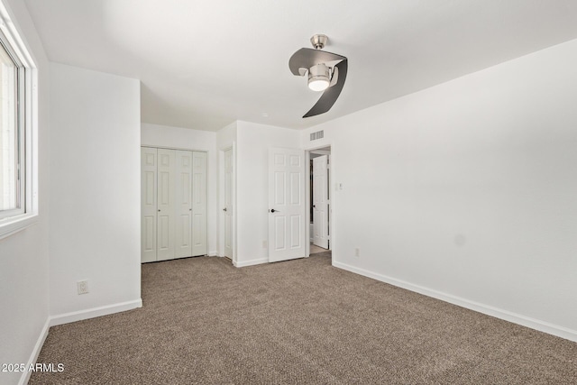 4629 S Mill Ave, Tempe, AZ 85282 - unfurnished bedroom with carpet floors, a closet, a ceiling fan, and multiple windows