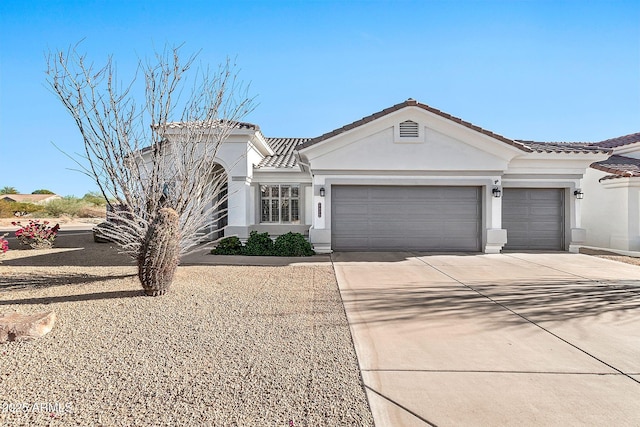 view of front of property with a garage