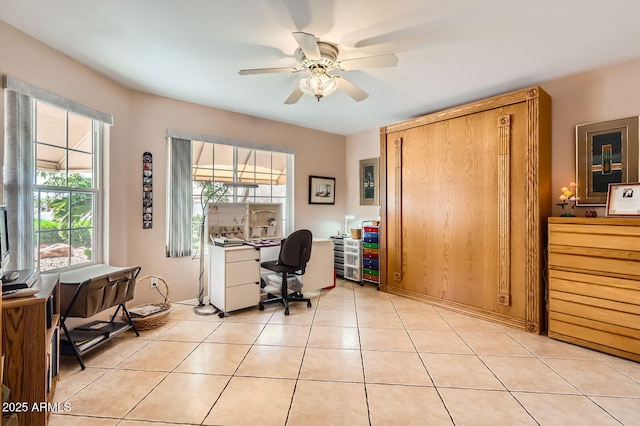 office area featuring light tile patterned floors and ceiling fan