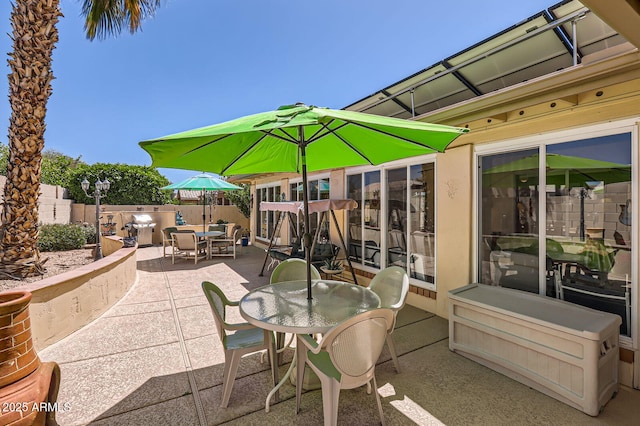 view of patio / terrace featuring outdoor dining space and a fenced backyard