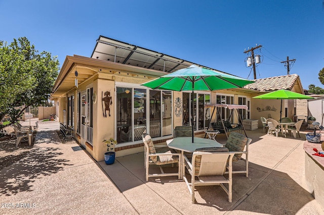 view of patio / terrace featuring outdoor dining space and fence