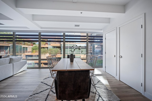 dining area featuring hardwood / wood-style floors and a healthy amount of sunlight