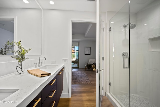 bathroom featuring vanity, hardwood / wood-style floors, and an enclosed shower