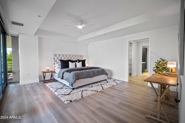 bedroom featuring light hardwood / wood-style floors, access to outside, and ceiling fan