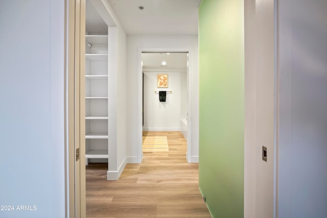 hallway featuring light hardwood / wood-style flooring