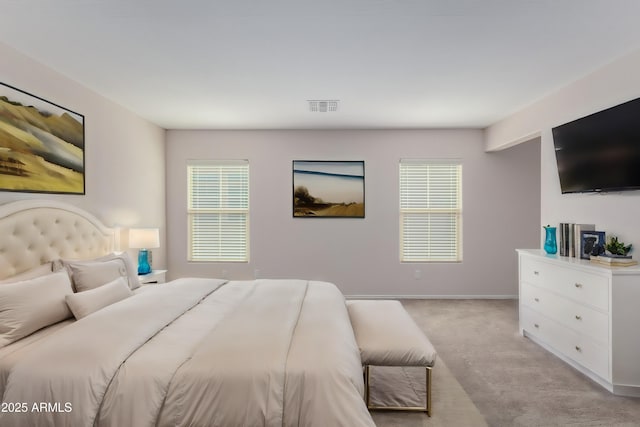 bedroom featuring light carpet