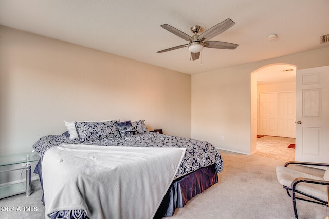 bedroom featuring light tile patterned floors and ceiling fan