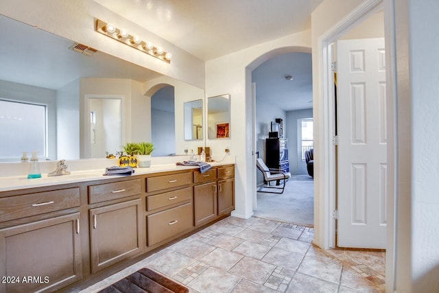 bathroom featuring tile patterned flooring and vanity