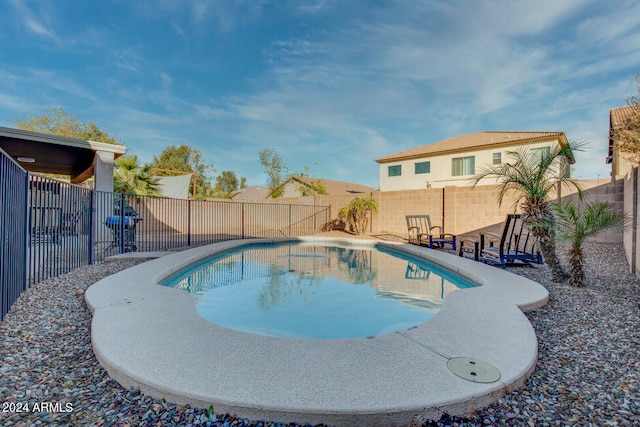 view of swimming pool featuring a patio area