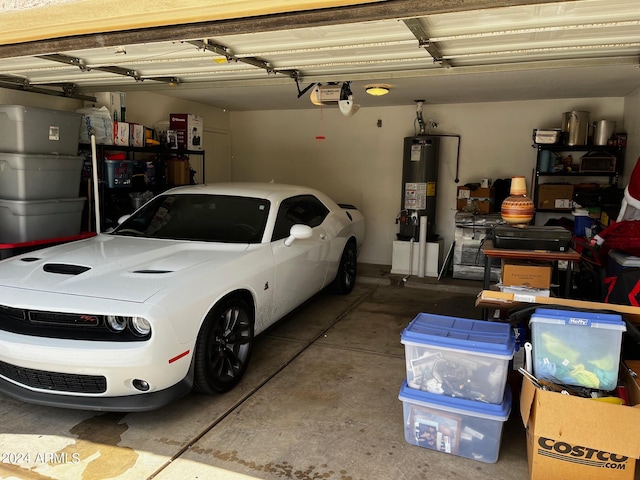 garage with a garage door opener and water heater