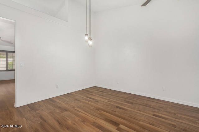 spare room with ceiling fan and hardwood / wood-style flooring