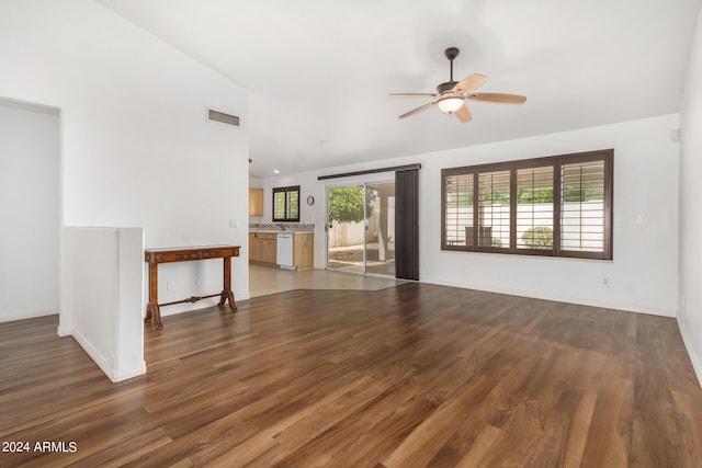 unfurnished living room featuring high vaulted ceiling, ceiling fan, and dark hardwood / wood-style flooring