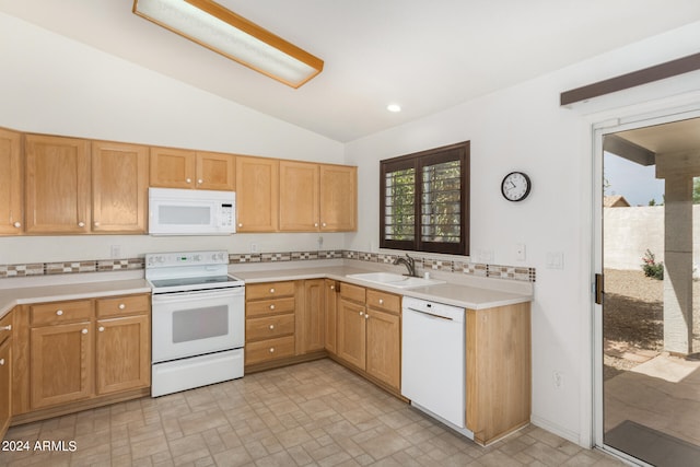 kitchen with tasteful backsplash, light tile patterned floors, sink, lofted ceiling, and white appliances