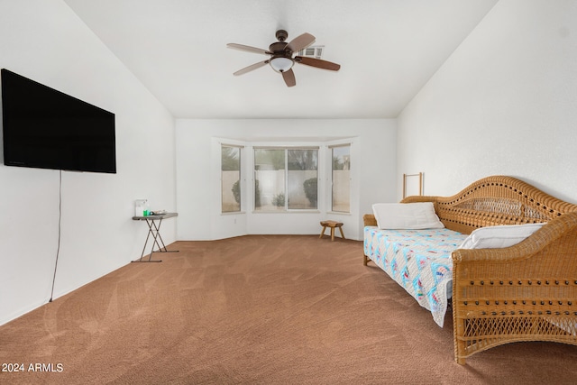 bedroom with ceiling fan, light carpet, and lofted ceiling