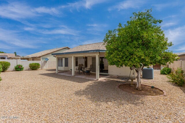 back of house featuring central AC unit and a patio