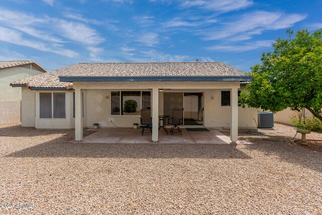 rear view of house featuring a patio area and central AC