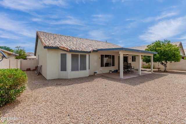 back of house with a patio