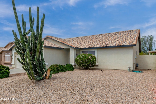 view of side of home with a garage