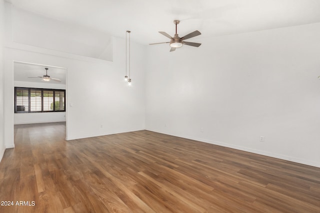 unfurnished room featuring high vaulted ceiling, ceiling fan, and hardwood / wood-style flooring