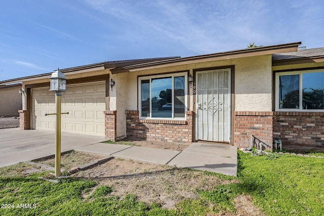 view of exterior entry featuring a garage