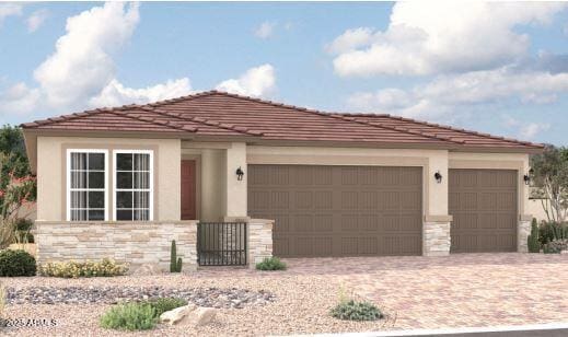 18225 W Hess St, Goodyear, AZ 85338 - view of front of property featuring stone siding, an attached garage, driveway, and stucco siding