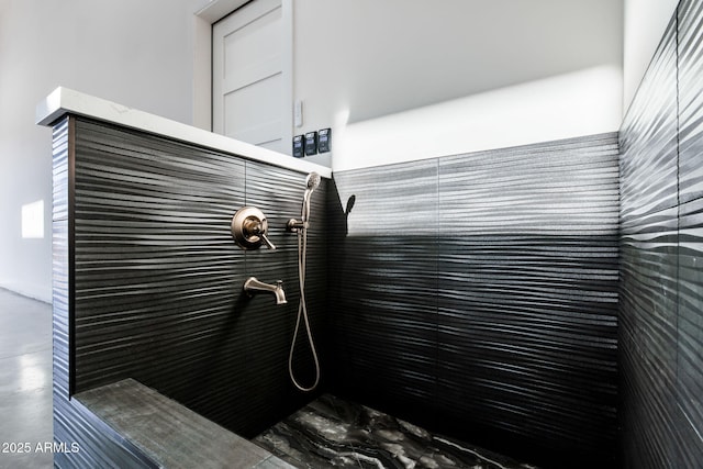 full bath featuring tiled shower
