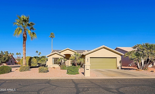 ranch-style house featuring solar panels and a garage