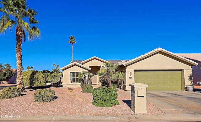 ranch-style house featuring a garage