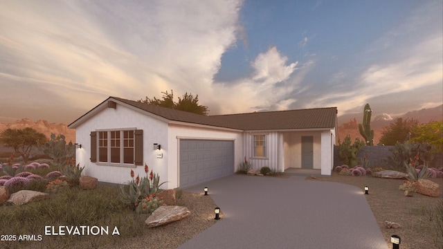 17605 N Bolerno Dr, Maricopa, AZ 85138 - view of front of property featuring an attached garage, concrete driveway, and stucco siding