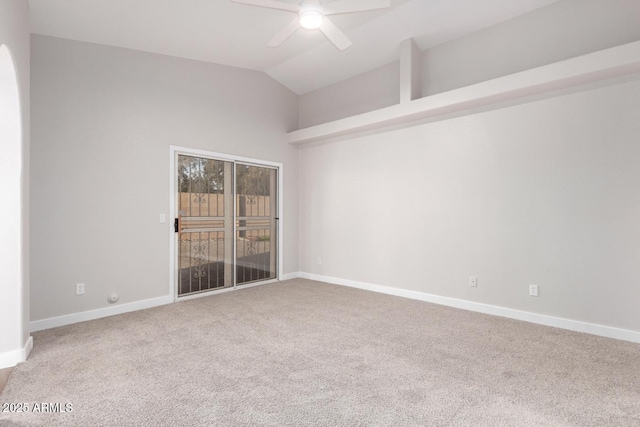 empty room with ceiling fan, vaulted ceiling, and carpet